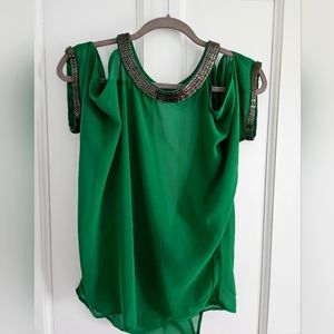 Green dress shirt size M. Metal decoration amd open crisscross back.